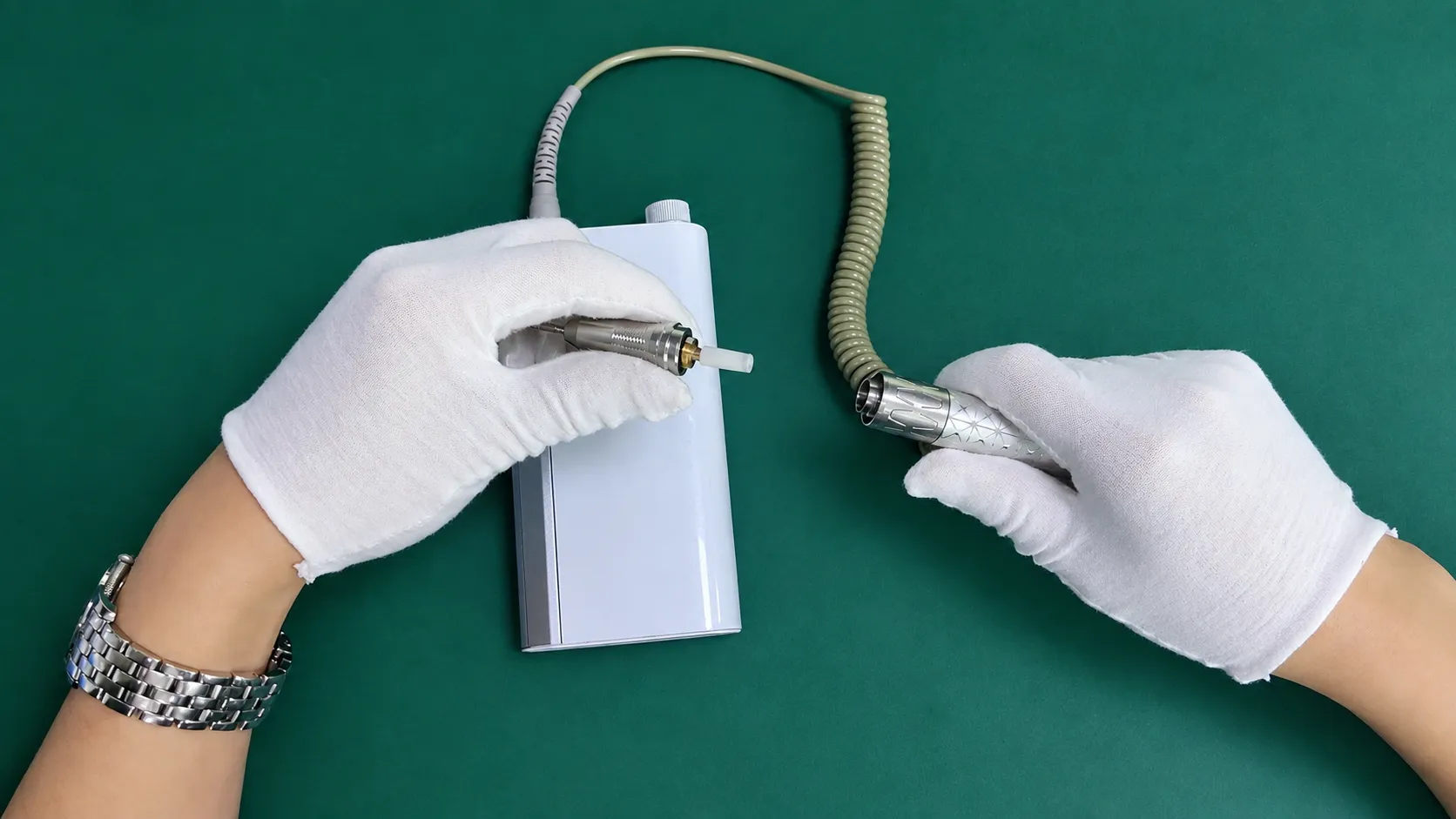 Removing front nose cap from high-speed electric grinder handpiece during motor teardown